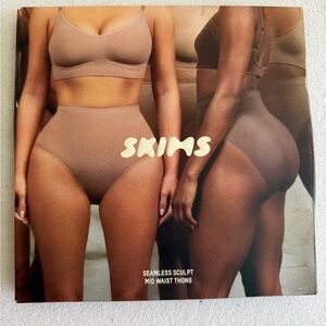 Unused SKIMS Tan Shapewear mid rise thong . Size XS